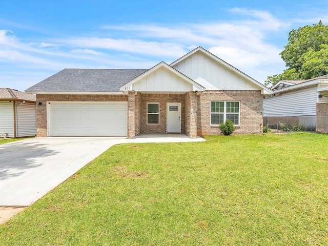 837 SE 68th St, Oklahoma City, OK 73149 - view of front of house featuring an attached garage, board and batten siding, driveway, brick siding, and a shingled roof