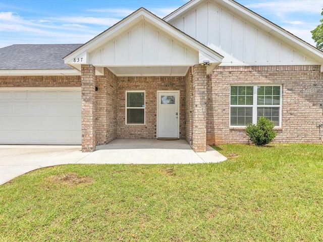 837 SE 68th St, Oklahoma City, OK 73149 - view of front of home featuring board and batten siding, a front yard, and brick siding