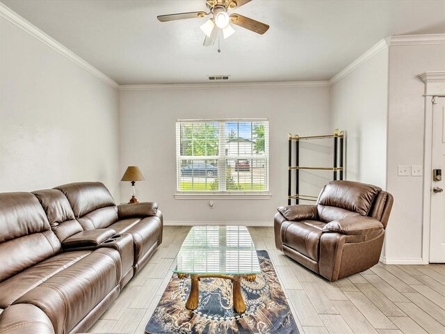 837 SE 68th St, Oklahoma City, OK 73149 - living room with ceiling fan, wood tiled floors, and ornamental molding