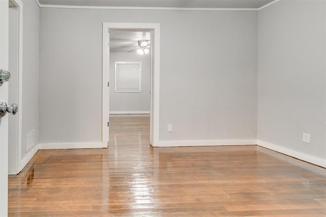 1617 SW 31st St, Oklahoma City, OK 73119 - empty room featuring a ceiling fan, wood finished floors, and crown molding