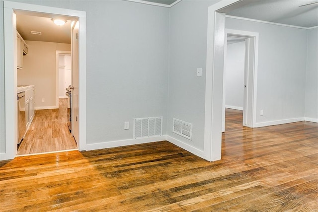 1617 SW 31st St, Oklahoma City, OK 73119 - spare room with light wood-type flooring and crown molding