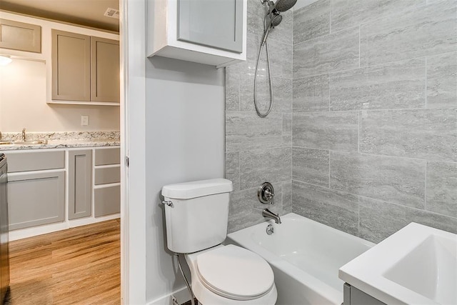 1617 SW 31st St, Oklahoma City, OK 73119 - bathroom with vanity, tub / shower combination, and wood finished floors