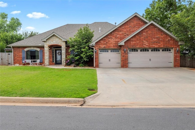1414 Chisholm Trl, Weatherford, OK 73096 - view of front facade with concrete driveway, a shingled roof, a garage, and brick siding