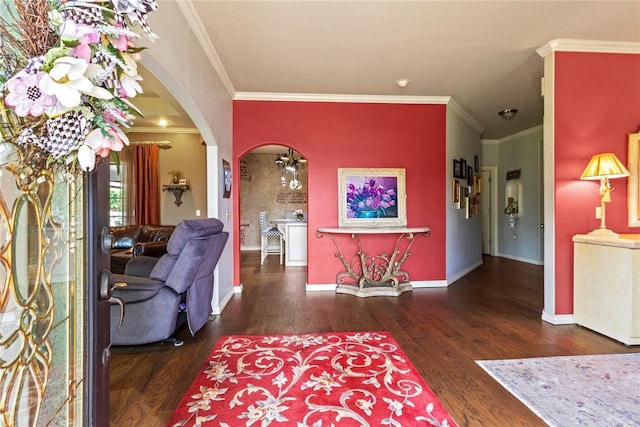 1414 Chisholm Trl, Weatherford, OK 73096 - living room with arched walkways, wood finished floors, and crown molding