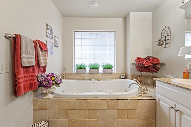 1414 Chisholm Trl, Weatherford, OK 73096 - bathroom featuring vanity and a jetted tub