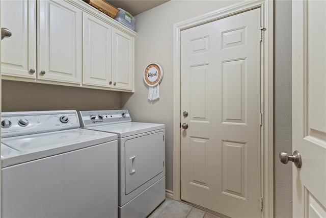 1414 Chisholm Trl, Weatherford, OK 73096 - washroom featuring independent washer and dryer, cabinet space, and light tile patterned floors