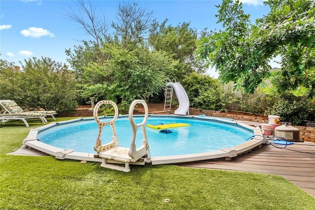 1414 Chisholm Trl, Weatherford, OK 73096 - view of pool with a water slide and a wooden deck