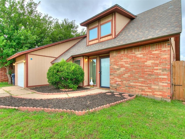 401 NW 120th St, Oklahoma City, OK 73114 - back of house with a garage, brick siding, a shingled roof, and driveway