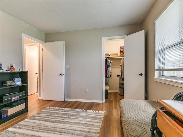 401 NW 120th St, Oklahoma City, OK 73114 - bedroom with wood finished floors, a walk in closet, and a closet