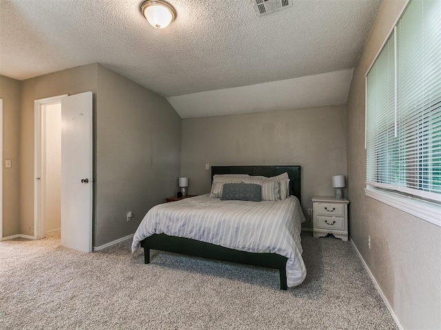 401 NW 120th St, Oklahoma City, OK 73114 - carpeted bedroom with a textured ceiling and lofted ceiling