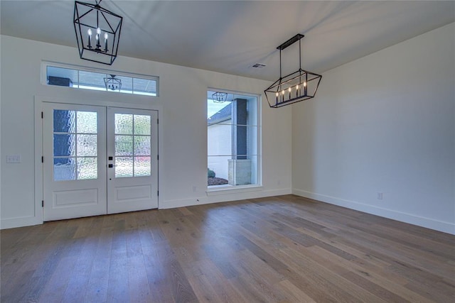 2006 Ithaca Dr, Norman, OK 73071 - foyer featuring a chandelier, wood finished floors, and french doors