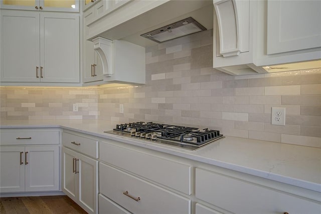 2006 Ithaca Dr, Norman, OK 73071 - kitchen featuring stainless steel gas stovetop, white cabinetry, and custom exhaust hood