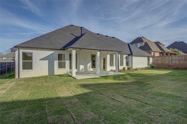 2006 Ithaca Dr, Norman, OK 73071 - rear view of house with a fenced backyard, a patio area, and roof with shingles