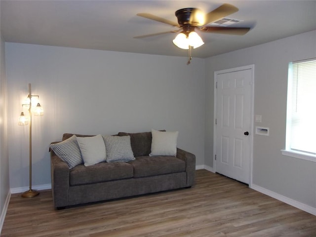 3018 N Beard Ave, Shawnee, OK 74804 - living room with a ceiling fan, wood finished floors, and plenty of natural light