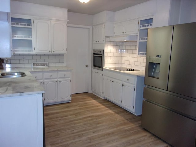 3018 N Beard Ave, Shawnee, OK 74804 - kitchen featuring appliances with stainless steel finishes, open shelves, white cabinets, and light wood finished floors