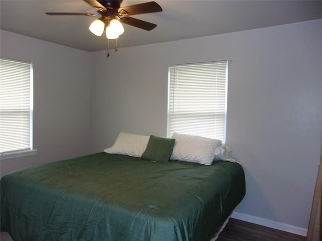 3018 N Beard Ave, Shawnee, OK 74804 - bedroom with wood finished floors and a ceiling fan