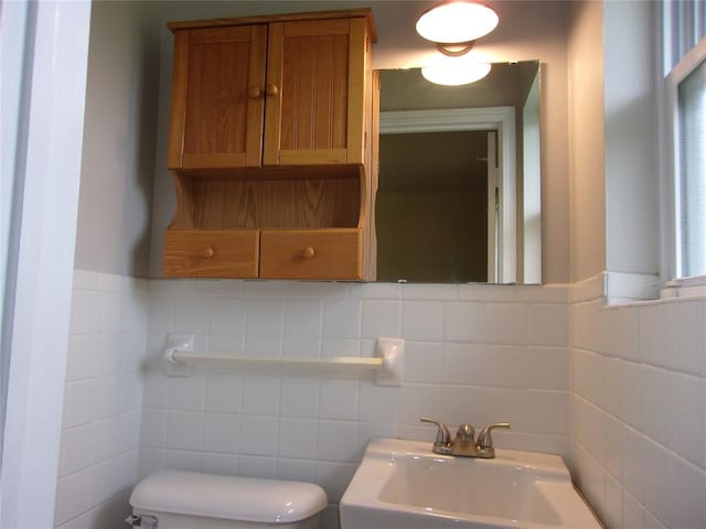 3018 N Beard Ave, Shawnee, OK 74804 - half bathroom featuring tasteful backsplash and tile walls