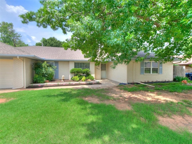 2317 NW 119th St, Oklahoma City, OK 73120 - ranch-style home featuring brick siding, a front lawn, an attached garage, and a shingled roof