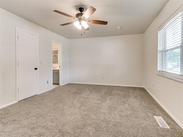2317 NW 119th St, Oklahoma City, OK 73120 - unfurnished room with light carpet, a ceiling fan, and a smoke detector