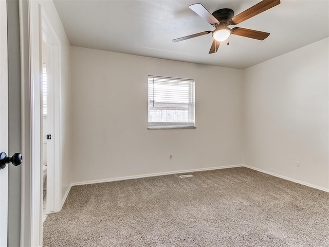 2317 NW 119th St, Oklahoma City, OK 73120 - carpeted spare room featuring ceiling fan and baseboards