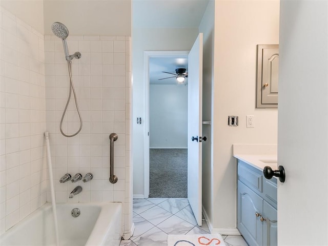 2317 NW 119th St, Oklahoma City, OK 73120 - bathroom featuring vanity, a ceiling fan, shower / bath combination, and marble look tile flooring