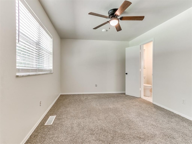 2317 NW 119th St, Oklahoma City, OK 73120 - unfurnished bedroom featuring carpet, ensuite bath, and a ceiling fan