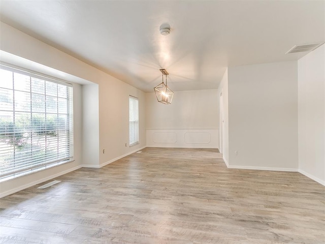 2317 NW 119th St, Oklahoma City, OK 73120 - spare room with light wood-type flooring and a smoke detector