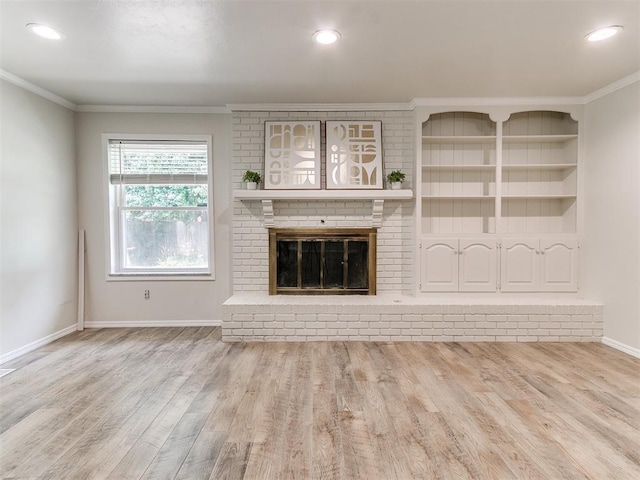 2317 NW 119th St, Oklahoma City, OK 73120 - unfurnished living room with ornamental molding, wood finished floors, a fireplace, recessed lighting, and built in features