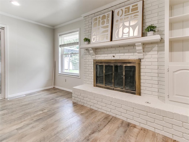 2317 NW 119th St, Oklahoma City, OK 73120 - unfurnished living room with wood finished floors, crown molding, and a fireplace