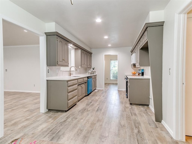 2317 NW 119th St, Oklahoma City, OK 73120 - kitchen featuring stainless steel appliances, light countertops, light wood-style floors, gray cabinets, and recessed lighting