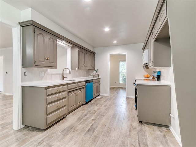 2317 NW 119th St, Oklahoma City, OK 73120 - kitchen featuring dishwasher, stainless steel range with electric cooktop, light wood-style flooring, backsplash, and recessed lighting