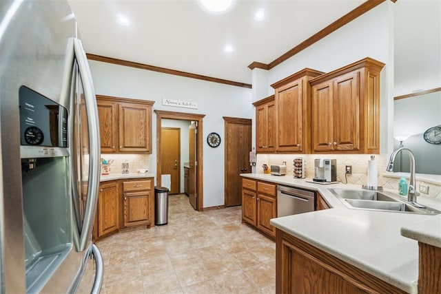 12409 Gaylon Cir, Oklahoma City, OK 73170 - kitchen with stainless steel appliances, ornamental molding, backsplash, brown cabinets, and light countertops