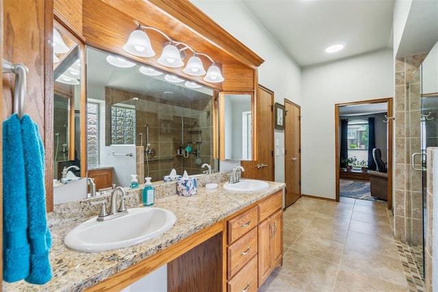 12409 Gaylon Cir, Oklahoma City, OK 73170 - full bathroom with a shower stall, double vanity, and tile patterned flooring