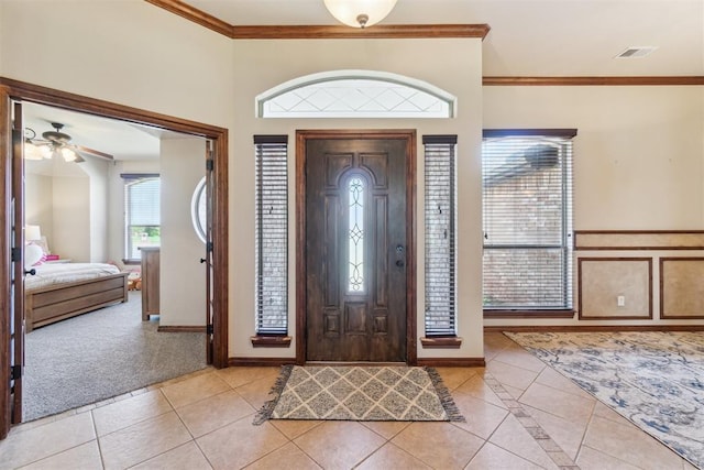 1600 SW 123rd St, Oklahoma City, OK 73170 - entrance foyer featuring light tile patterned floors, crown molding, and a ceiling fan