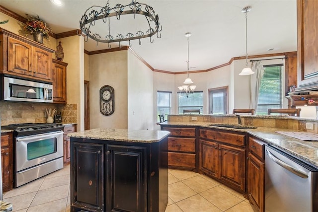 1600 SW 123rd St, Oklahoma City, OK 73170 - kitchen featuring appliances with stainless steel finishes, light tile patterned floors, crown molding, and light stone counters