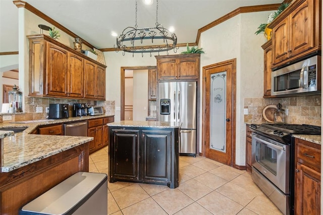 1600 SW 123rd St, Oklahoma City, OK 73170 - kitchen with appliances with stainless steel finishes, tasteful backsplash, light stone counters, light tile patterned floors, and ornamental molding