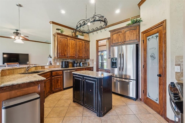 1600 SW 123rd St, Oklahoma City, OK 73170 - kitchen with appliances with stainless steel finishes, light stone counters, light tile patterned floors, ceiling fan, and crown molding