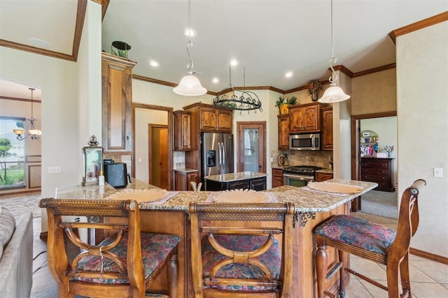 1600 SW 123rd St, Oklahoma City, OK 73170 - kitchen featuring stainless steel appliances, ornamental molding, tasteful backsplash, a chandelier, and light tile patterned flooring