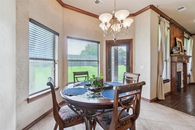 1600 SW 123rd St, Oklahoma City, OK 73170 - dining room with a textured wall, crown molding, a chandelier, and light tile patterned flooring