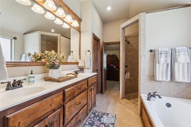 1600 SW 123rd St, Oklahoma City, OK 73170 - bathroom featuring double vanity, a garden tub, tile patterned floors, tiled shower, and ensuite bath