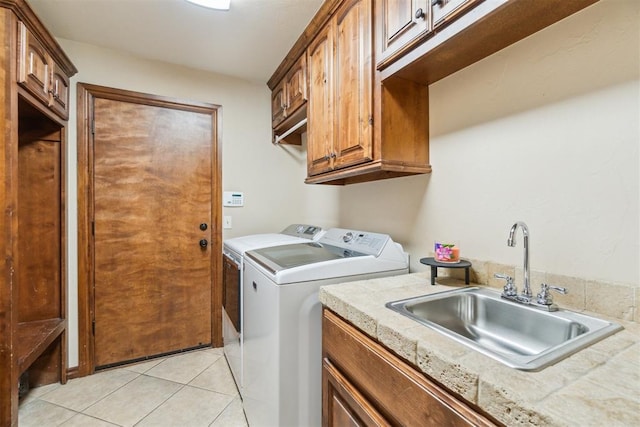 1600 SW 123rd St, Oklahoma City, OK 73170 - washroom featuring washing machine and clothes dryer, light tile patterned floors, and cabinet space