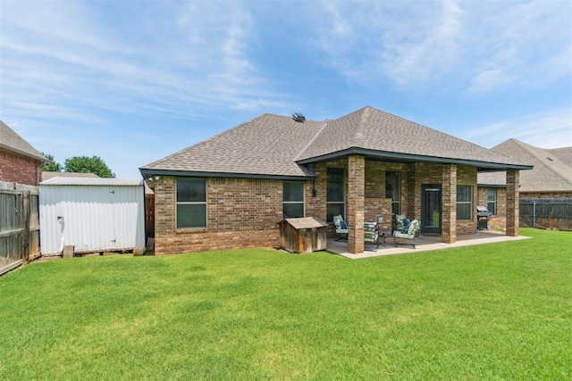 1600 SW 123rd St, Oklahoma City, OK 73170 - back of property with a storage unit, a shingled roof, brick siding, a patio area, and a fenced backyard