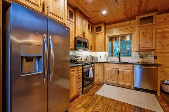 64 Mountain Alder Trl, Broken Bow, OK 74728 - kitchen featuring appliances with stainless steel finishes, wooden ceiling, dark countertops, dark wood-style floors, and decorative backsplash