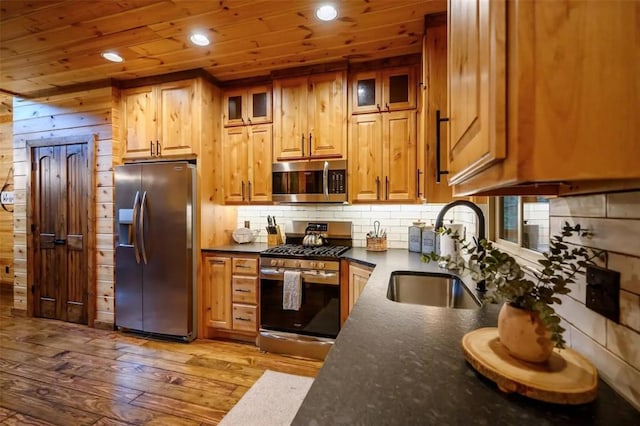64 Mountain Alder Trl, Broken Bow, OK 74728 - kitchen featuring appliances with stainless steel finishes, wood finished floors, wood ceiling, recessed lighting, and backsplash