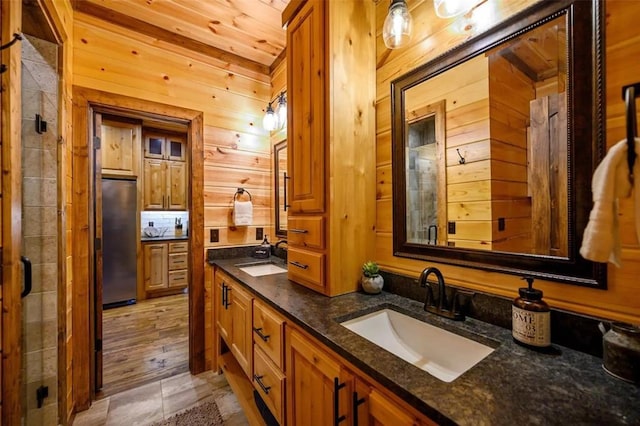 64 Mountain Alder Trl, Broken Bow, OK 74728 - full bathroom with double vanity, wooden walls, and a stall shower