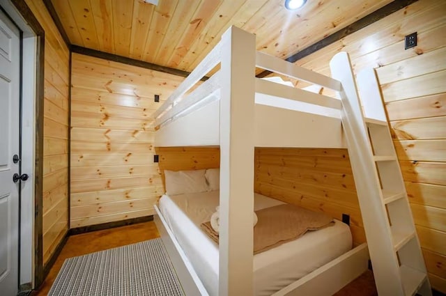 64 Mountain Alder Trl, Broken Bow, OK 74728 - unfurnished bedroom featuring wooden ceiling, wood walls, and vaulted ceiling