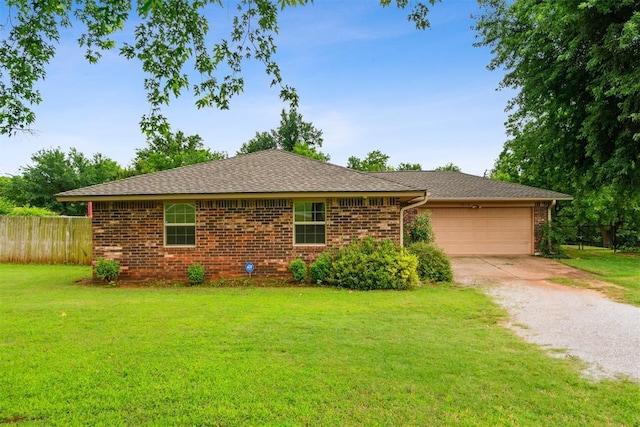 3414 Clayton Dr, Tuttle, OK 73089 - view of front of property with driveway, a garage, brick siding, and a shingled roof