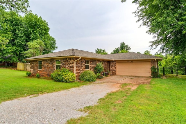 3414 Clayton Dr, Tuttle, OK 73089 - ranch-style house with driveway, an attached garage, and brick siding