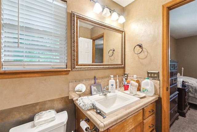 3414 Clayton Dr, Tuttle, OK 73089 - bathroom featuring vanity and a textured wall