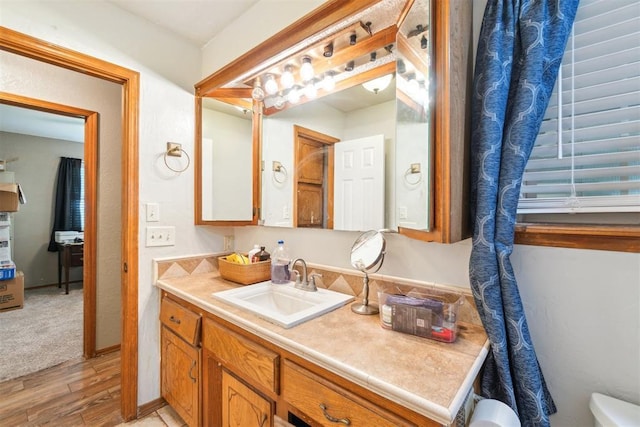 3414 Clayton Dr, Tuttle, OK 73089 - bathroom featuring vanity and wood finished floors